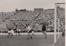Ron Baynham and Wally Shanks watch this effort by Bob Ayre drift harmlessly over the bar