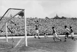 Sam Bartram palms the ball away with Gordon Turner in close attendance