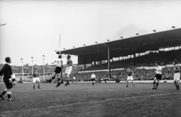 Peter MacEwan challenges for high ball with Harry Mattinson
