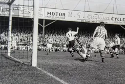 Jim Sanders dives on the ball before Jimmy Adam and Peter MacEwan can react