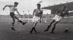 Gordon Turner shoots past Roy Gratrix and George Farm but its off target