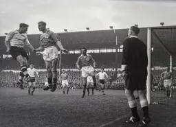 Peter MacEwan loses out as ball is headed clear