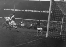 Peter MacEwan moves in but Con Sullivan has the ball under control