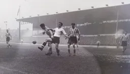 Bob Morton sticks a leg out to try and win the ball
