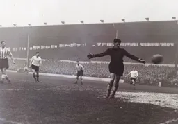 Bob Morton watches as the ball drifts just wide of the goal