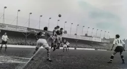 Bob Morton and Jimmy Adam watch as Gordon Turner is out numbered jumping for the ball