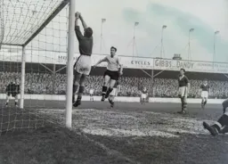 Bob Morton jumps but Ron Howells has aleady used his fists to clear the ball