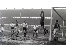 Jimmy O`Neill catches a high ball as Bob Morton looks for a possible fumble