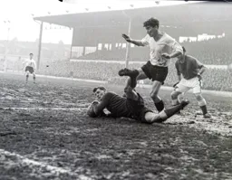 Jimmy O`Neill dives at the feet of Jimmy Adam