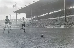 A determined looking Bob Morton chases the ball
