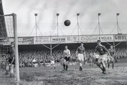 Bob Morton and centre of picture future Hatter Gordon Fincham watch as the ball flys across the goalmouth