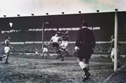 Gil Merrick punches the ball clear of Reg Pearce