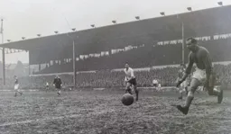 Bob Morton and Gil Merrick watch the ball drift wide of the goal