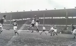Roy Davies and Stan Wicks jump for a high ball