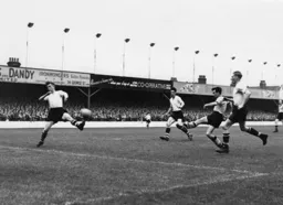 Wally Shanks is unable to block this shot by Jimmy Murray