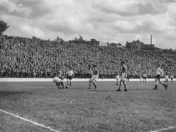 Eddie Marsh puts a stop to this attack to thwart Gordon Turner and Bob Morton