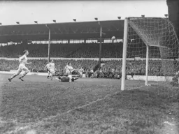 Reg Pearce blazes this chance over the cross bar