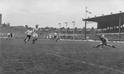 The ball has gone and this effort by Gordon Turner goes wide of the target