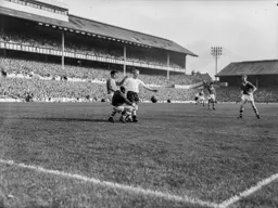 Jim Pemberton and Bernard Streten combine to stop Alfie Stokes