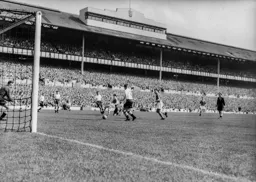 Gordon Turner and Bob Morton threaten the Spus goal