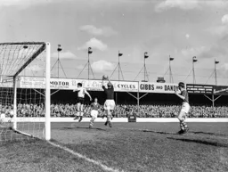 Gordon Turner jumps but Roy Wood makes a safe catch