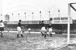 Roy Davies can only watch as Ted Ditchburn catches the ball