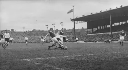 Allan Brown is stopped in his tracks by Bobby Seith