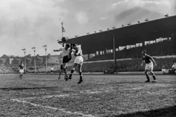 Roy Davies sticks the boot into Jackie Blanchflower