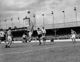 John Groves, Gordon Turner and Allan Brown look on as Eric Bell heads the ball clear for Bolton