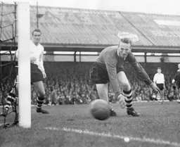 Ron Baynham watches the ball go wide