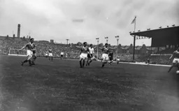 All eyes follow the ball as it heads towards the goal