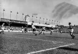 Gordon Turner fies in a shot at goal despite Brian Miller attempting to block it