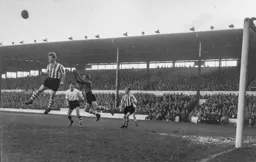 An open mouthed Gordon Turner watches a defender head the ball clear for Wednesday