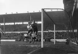 Wednesday keeper Charlie Pllu feels the full force of Gordon Turner`s challenge