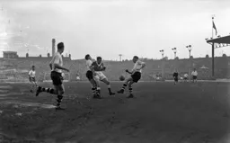 Syd Owen and Bob Morton combine to halt this Forest attack