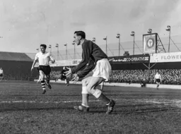 Gordon Turner and Chic Thomson search for the ball