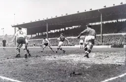 Vic Crowe clears the ball for Villa and all John Groves and Gordon Turner can do is take a watching breif