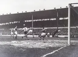 Vic Crowe heads the ball clear for Villa with Gordon Turner in close proximity