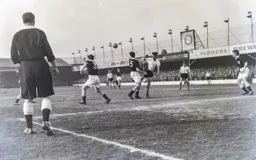 The ball sails across the Spurs penalty area but John Groves misses it