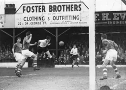 John Groves wins a header in the Portsmouth penalty area