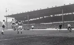 Allan Brown gets above John Mortimore to send a header towards goal