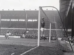 The ball slips through the fingers of Chelsea keeper Reg Matthews but the ball stayed out