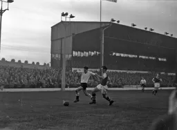 Gordon Turner gets past Jim Dugdale