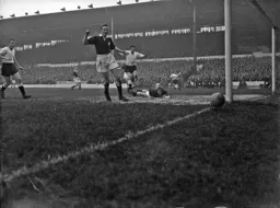 A shot from Dave Pacey (in the background) is just off target