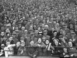 The two boys at the front have their rattles at the ready