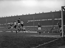 Tony Gregory and Allan Brown compete for the ball with Spurs Maurice Norman