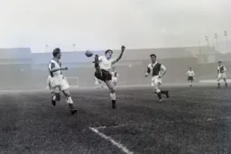 Gordon Turner raises his foot but cannot make a clean contact with the ball