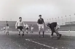 Bob Morton and Jack Charlton watch as Roy Wood takes control of the ball