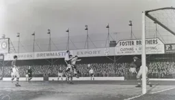 Allan Brown and Bob Morton get the better of Jack Charlton to win this aerial battle