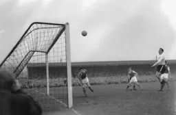 Billy Bingham (hidden behind the Ipswich defender) heads Town`s third goal